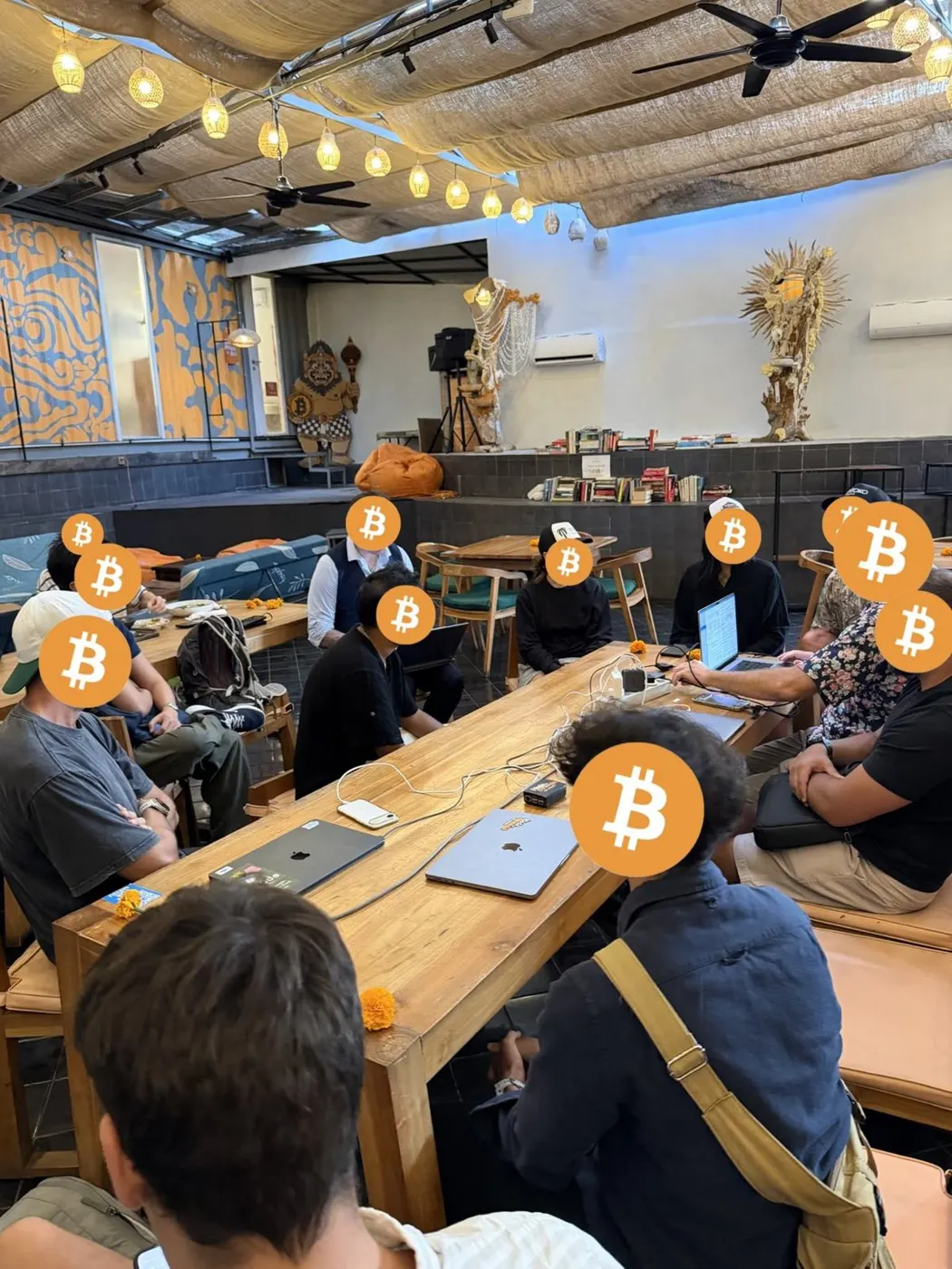 Code Orange learners talking around a table during a workshop