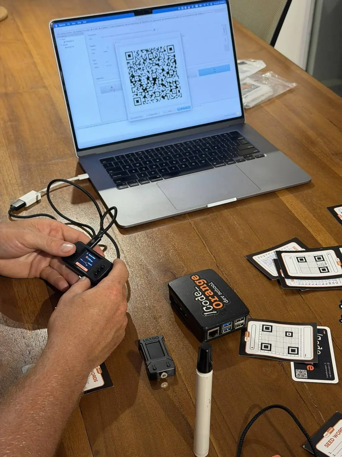 Code Review Club session with hardware wallet and laptop