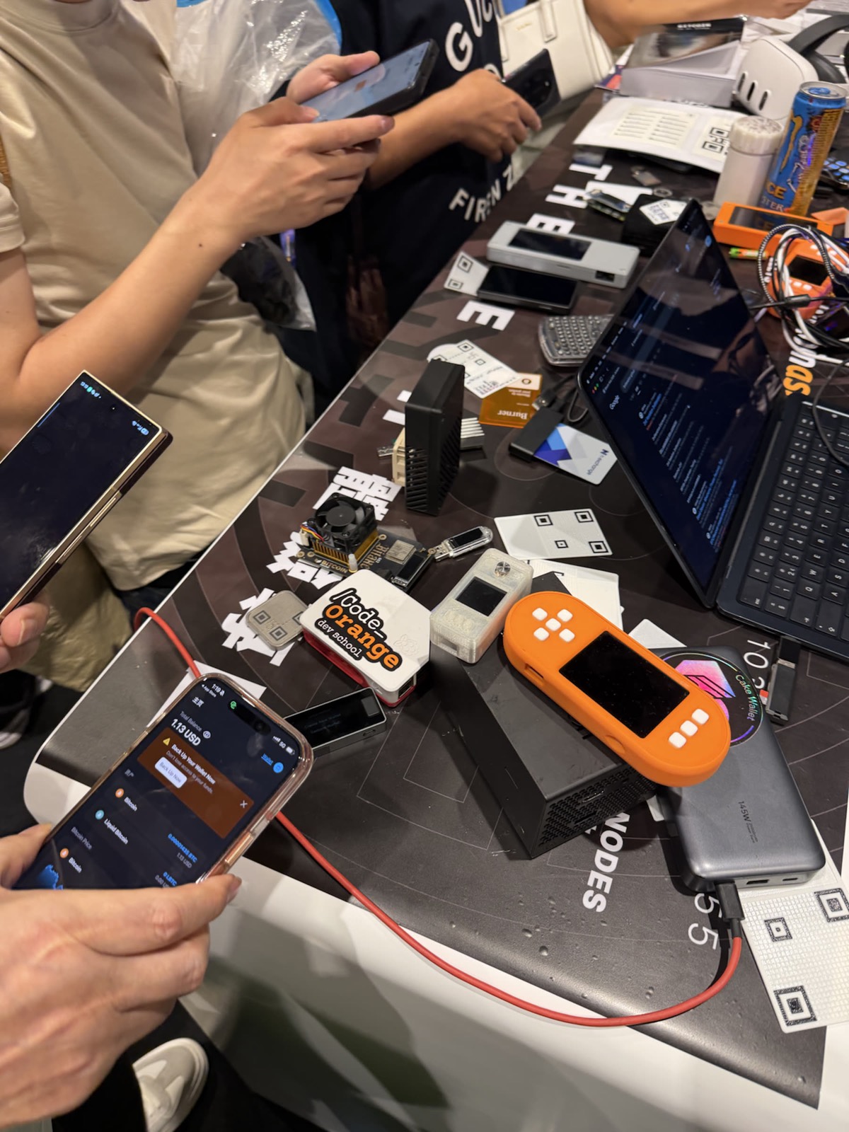 Code Orange students learning with laptops and hardware wallets