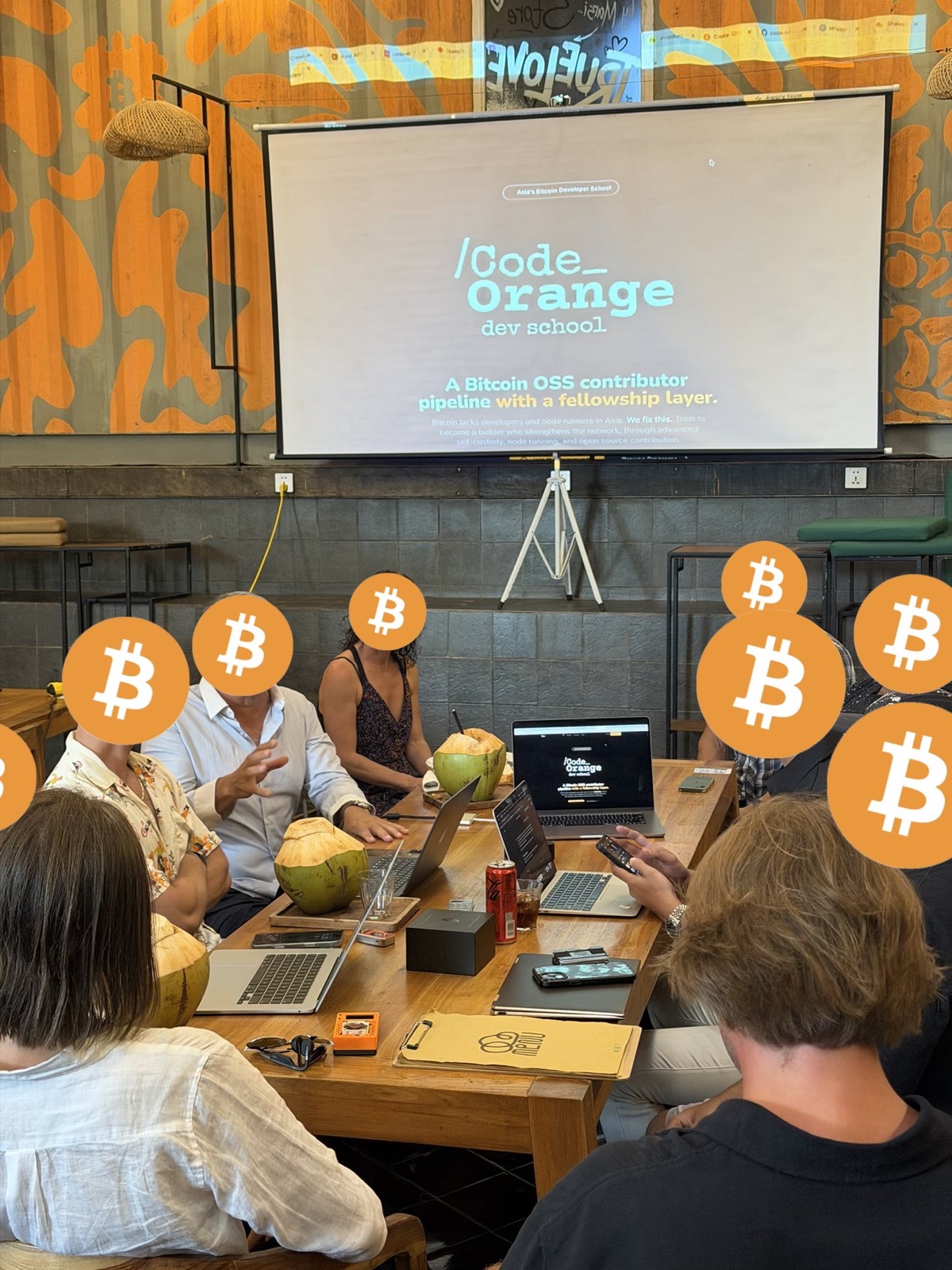 Code Orange workshop session with students around a table